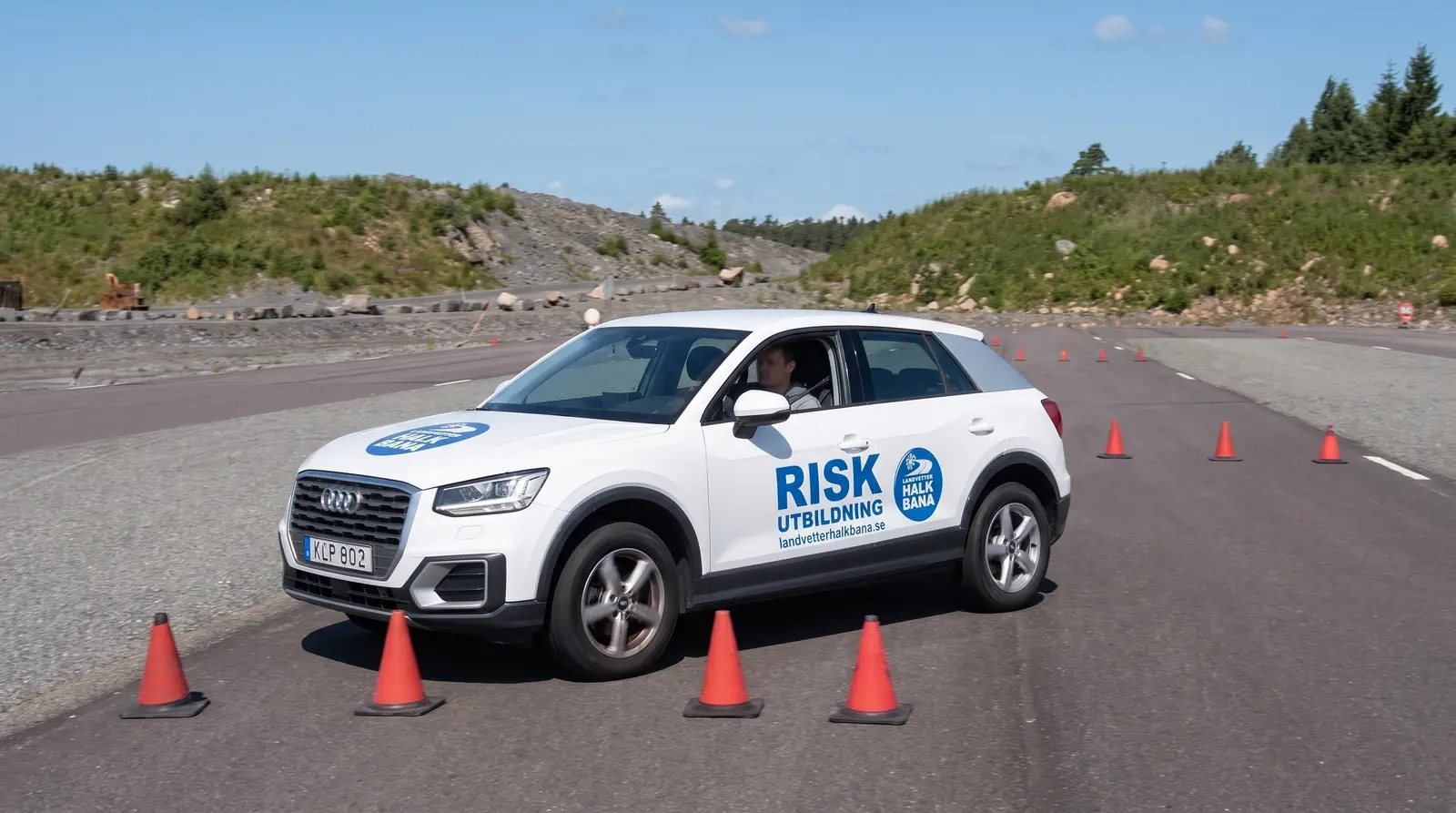 Illustration: training car weaving through cones on the skid pan