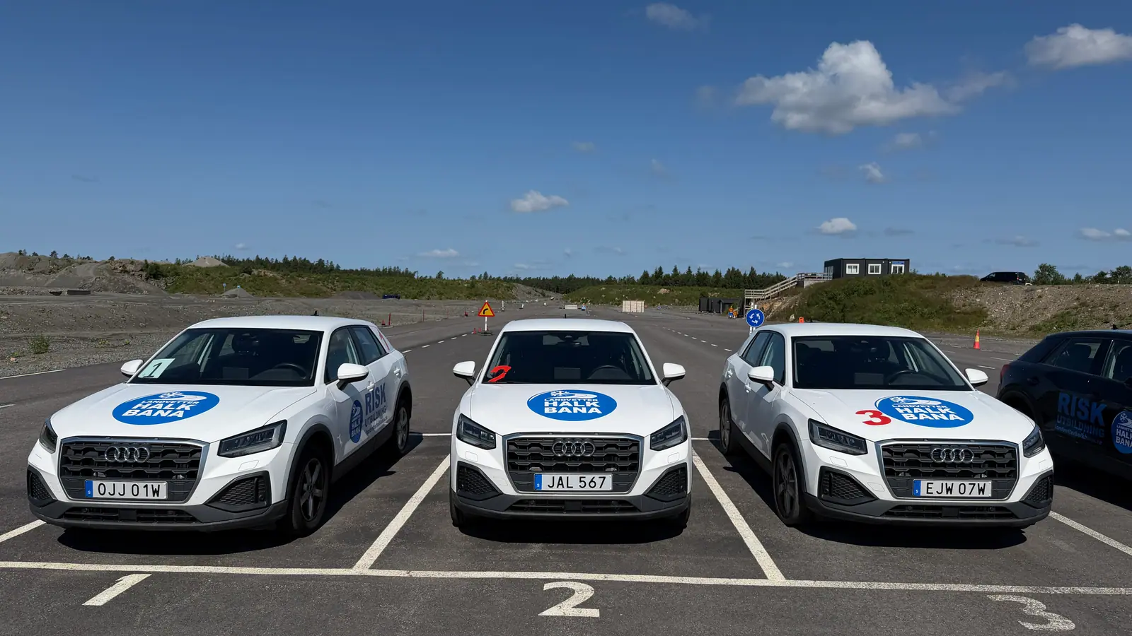 Three white training cars at Landvetter Halkbana